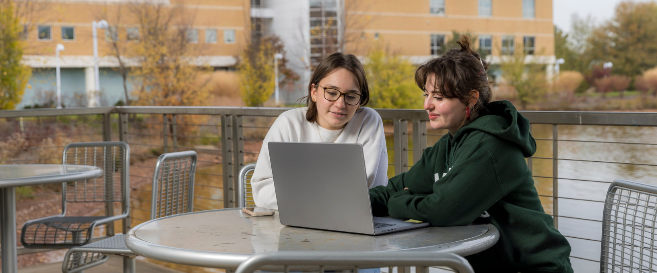 image of students sitting on campus